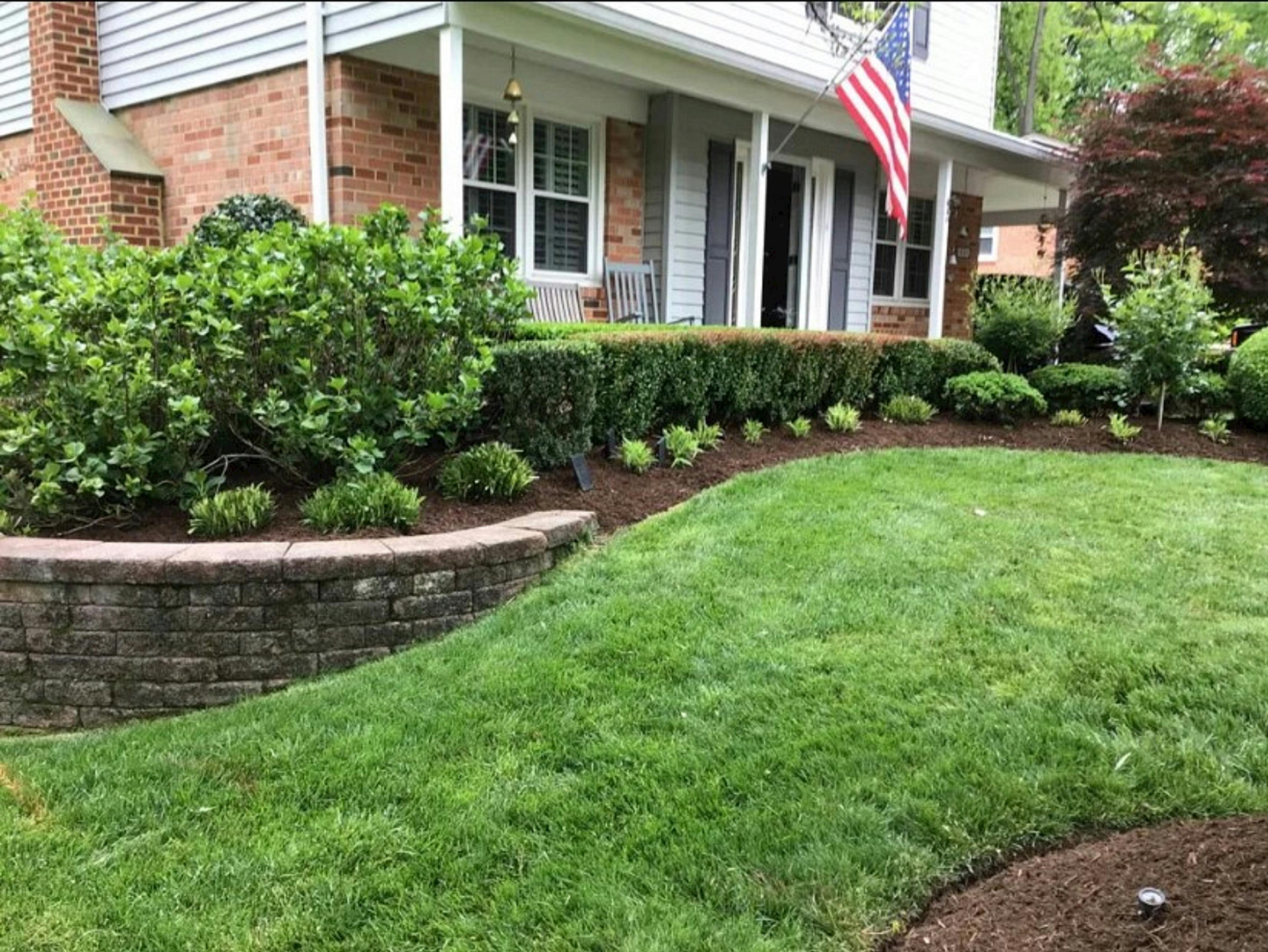 Well-maintained Gulf Coast home with manicured lawn and landscaping